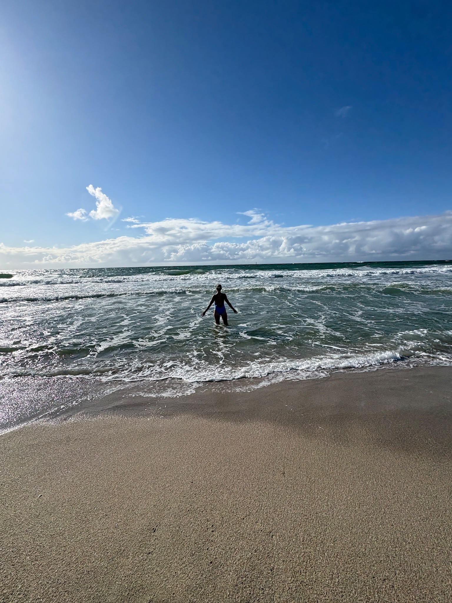 A person entering the ocean
